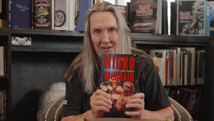 Watch: IRON MAIDEN Drummer NICKO MCBRAIN Unboxes His Autobiography 'Hello Boys And Girls!'